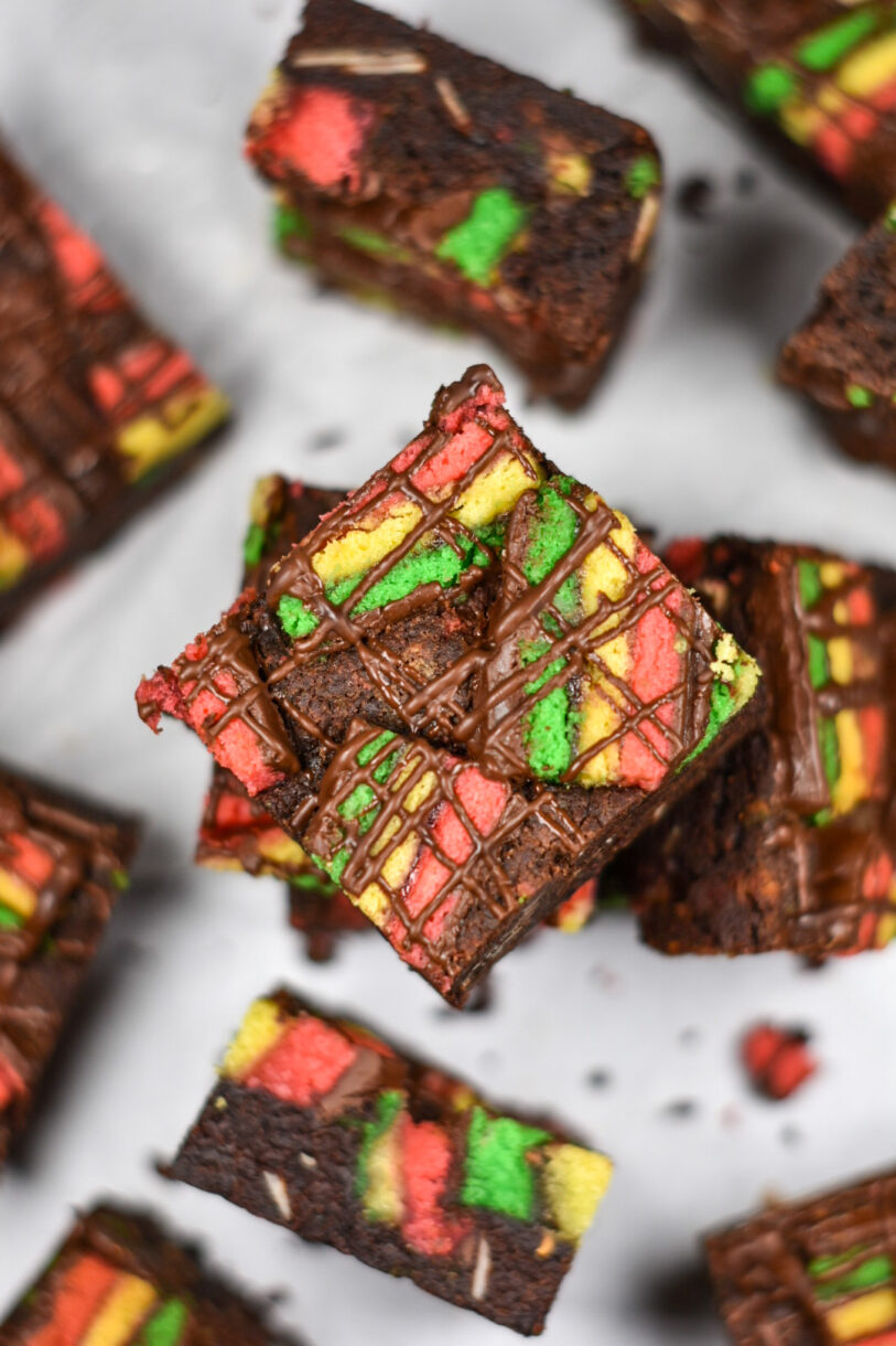 Looking down at a stack of Italian rainbow cookie brownies