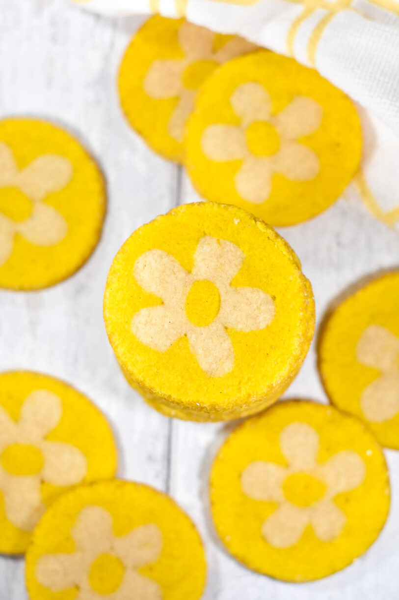Slice and bake flower cookies on a white wooden surface