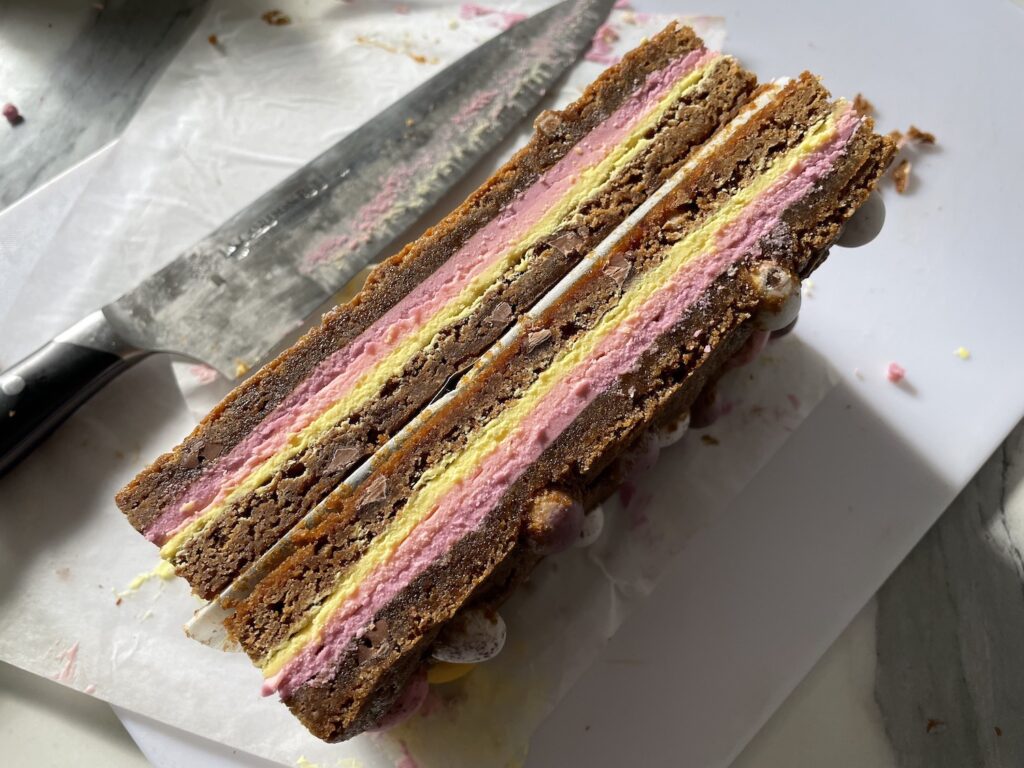 Trimmed mini egg blondies showing layers of ganache