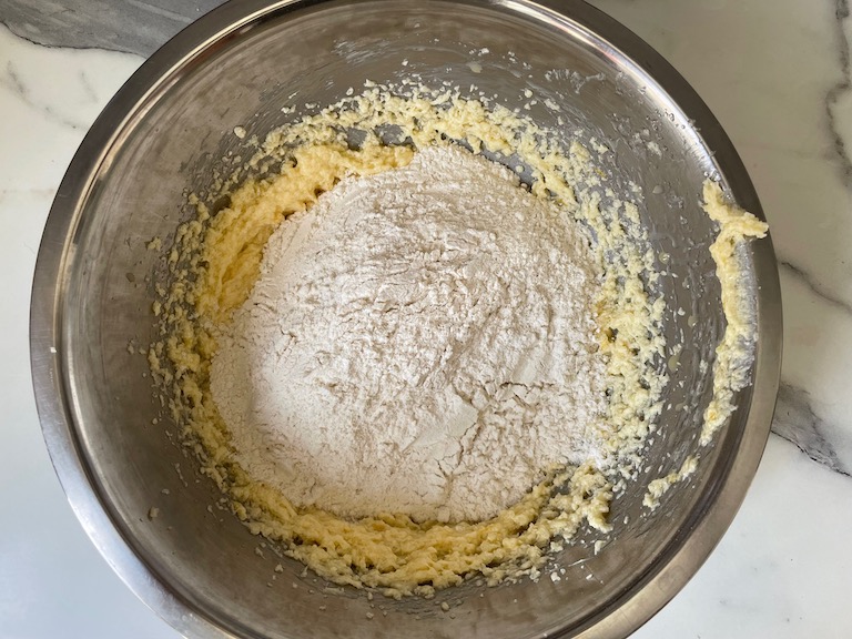 Adding dry ingredients to cookie dough