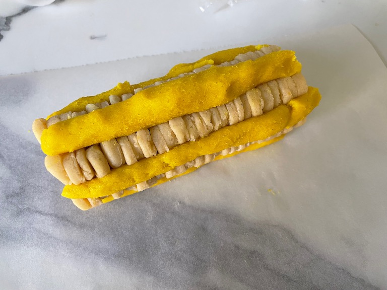 Roll of white and yellow cookie dough