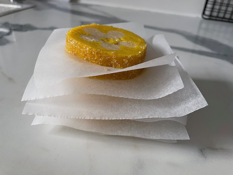 Stack of cookie slices between parchment