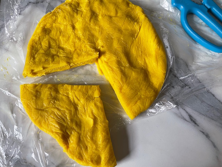 Yellow dough with a wedge removed