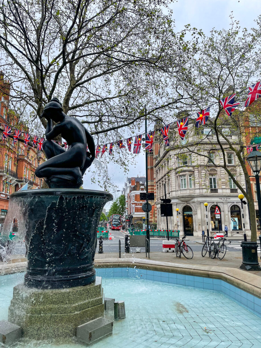 Coronation decorations in London, with the Sloane Square fountain in the foreground