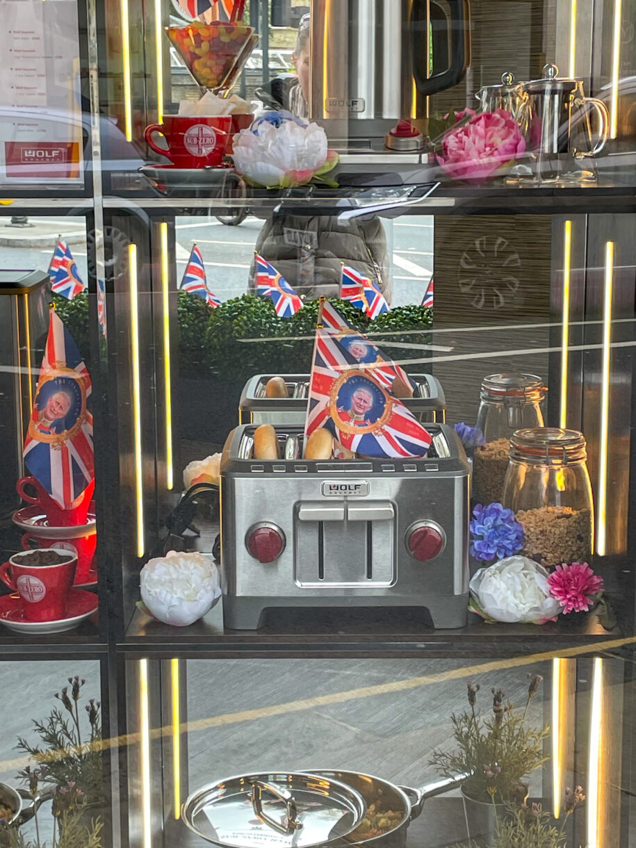 The window of an appliance store decorated for the Coronation of King Charles