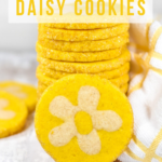Made with lemon juice, zest, and oil, this spring-inspired lemon daisy slice and bake cookie recipe features a vibrant yellow color, zesty lemon flavor, and a fun cut out flower surprise in the middle!
