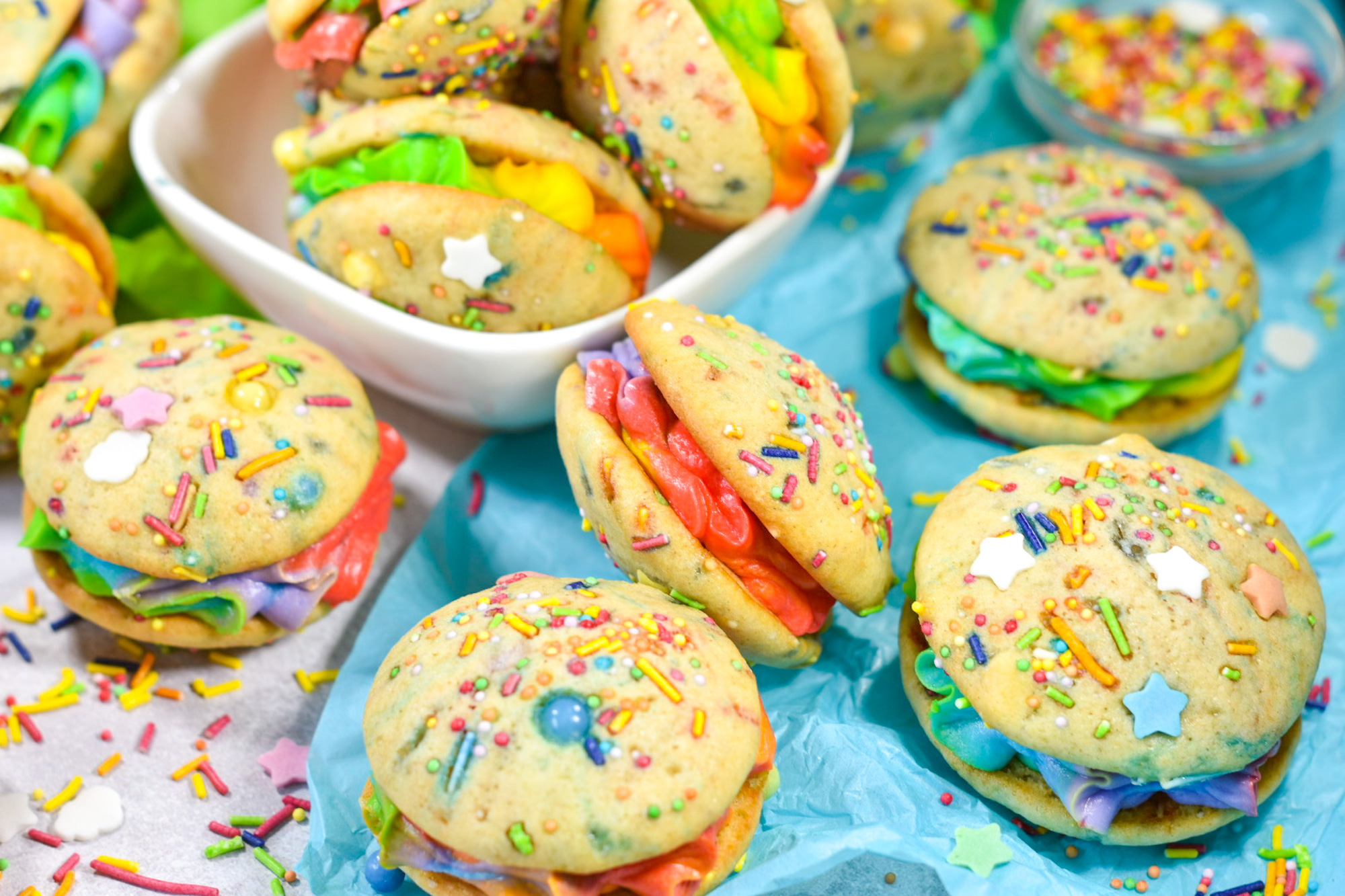 Rainbow Whoopie Pies on a sheet of blue tissue