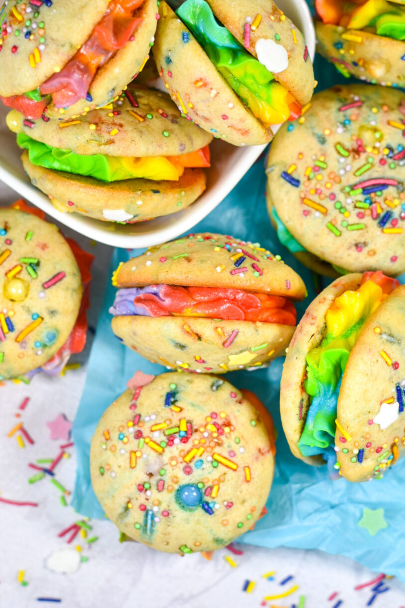 Rainbow Whoopie Pies on a sheet of blue tissue paper