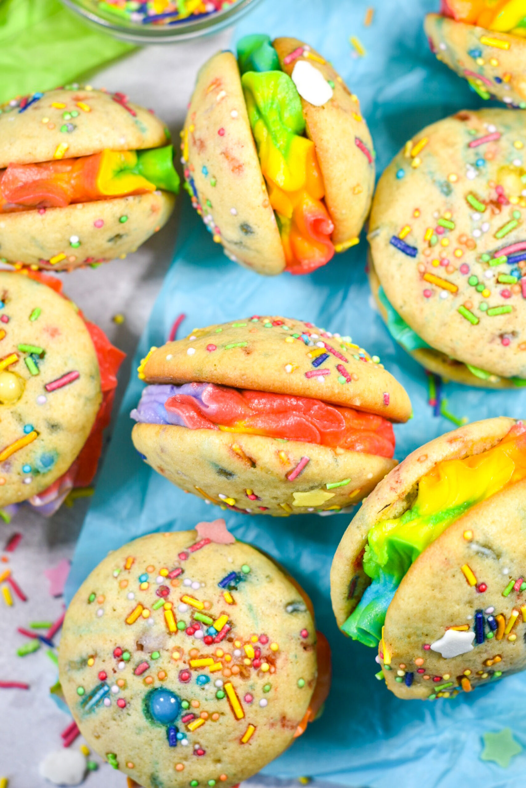 Rainbow Whoopie Pies on a sheet of blue tissue