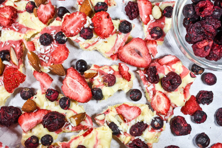 Patriotic berry bark and dried blueberries on a white background