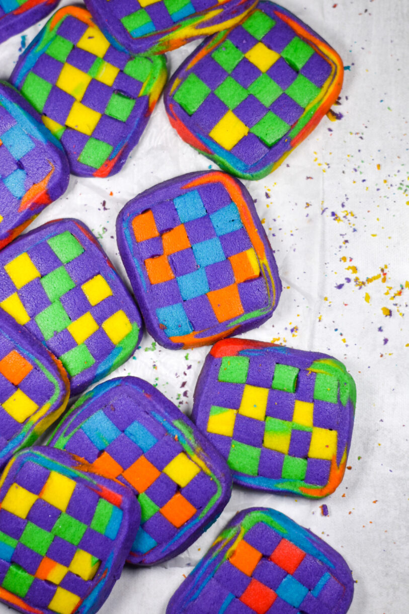 Geometric cookies on a white surface with cookie crumbs