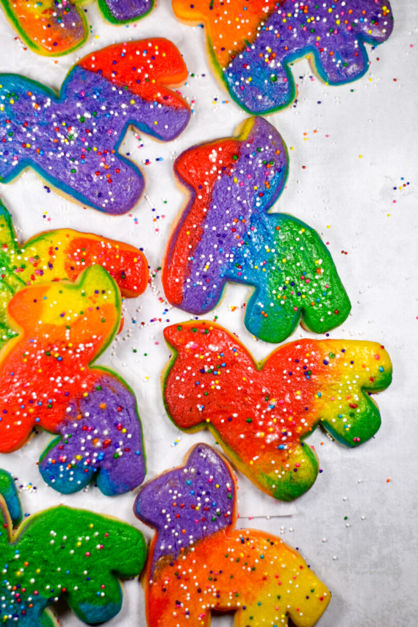 Rainbow Donkey Piñata cookies on a white background, with rainbow nonpareils