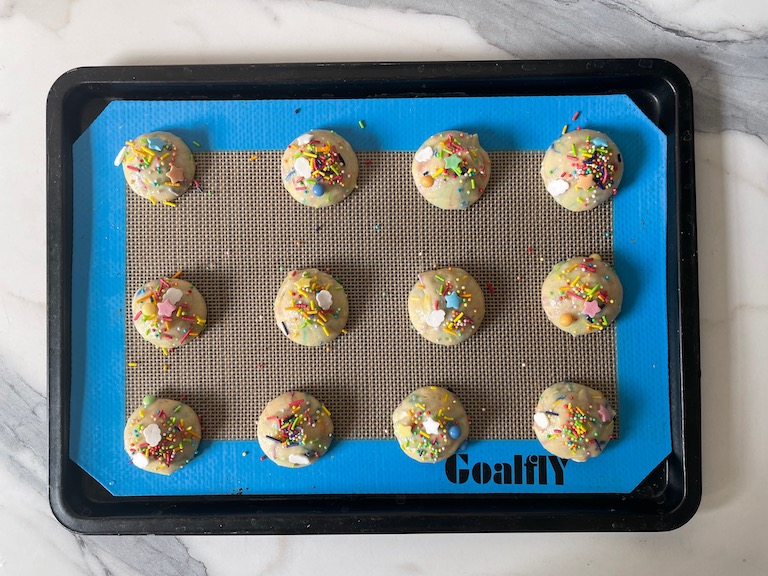 piped whoopie pie batter with sprinkles