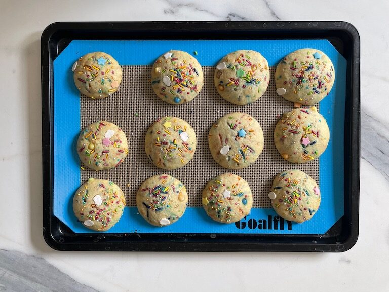 rainbow whoopie pie cakes on a tray