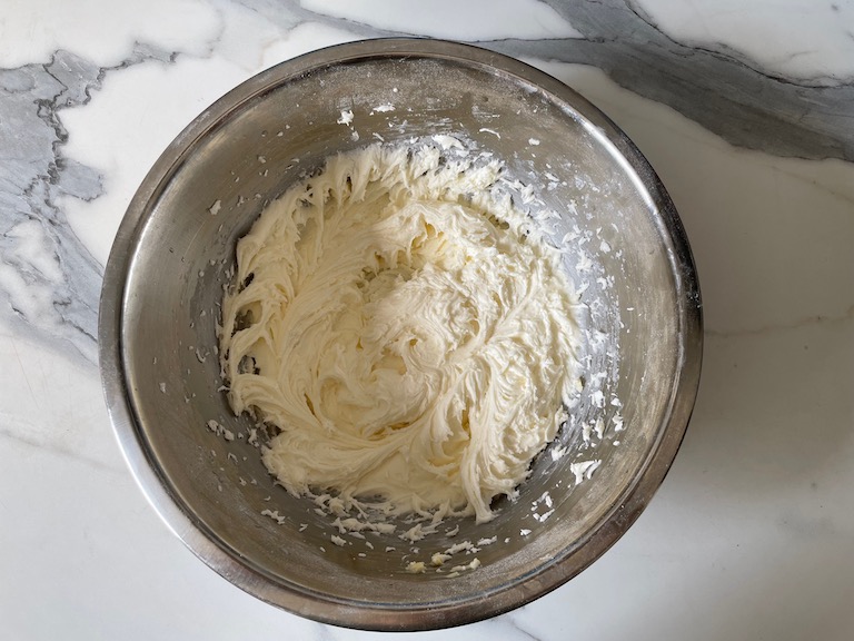 a metal bowl of buttercream