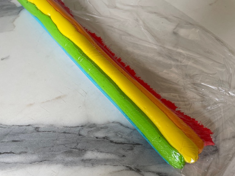 tube filled with rainbow buttercream