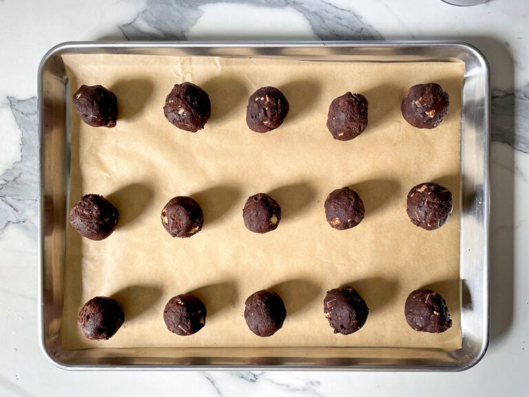 Balls of cookie dough on tray