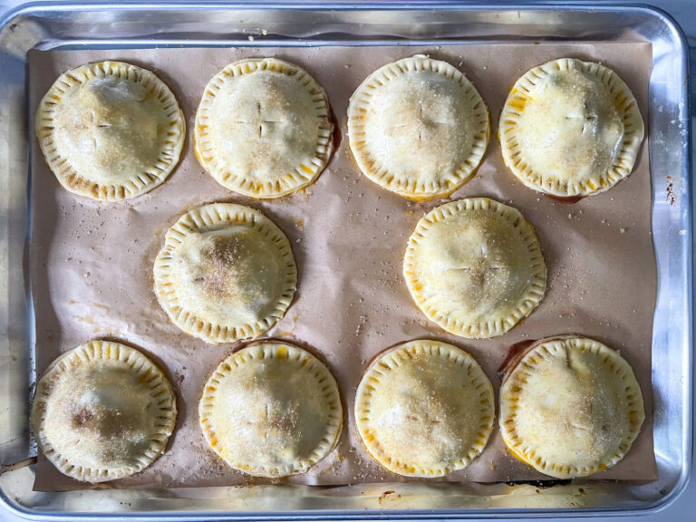 Unbaked hand pies on a tray
