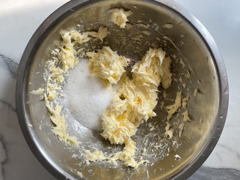 Butter in bowl with sugar
