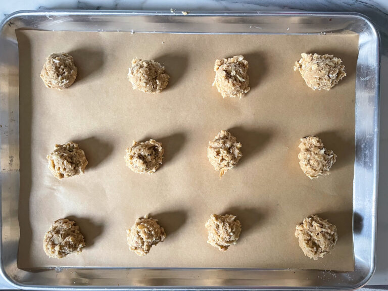Tray with rows of balls of unbaked cookie dough