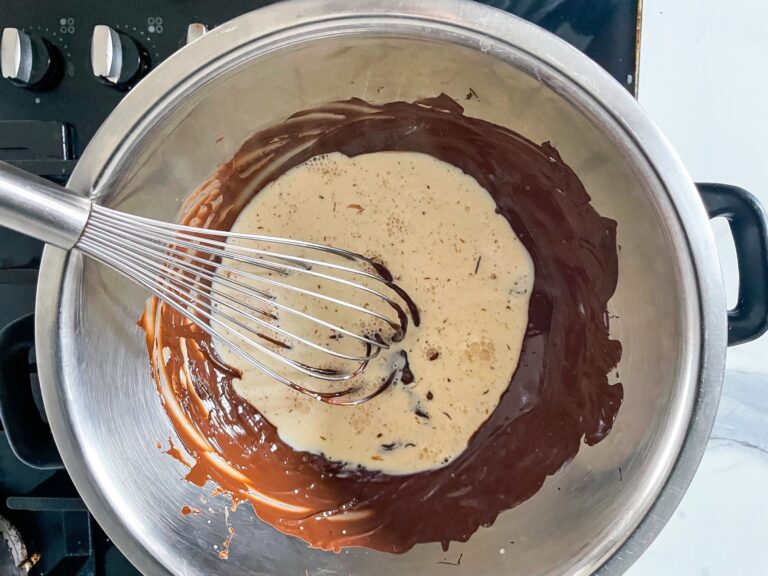 Cream in a bowl of melted chocolate