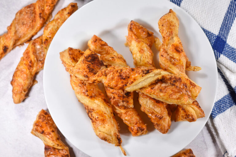 Cheese straws on a white plate