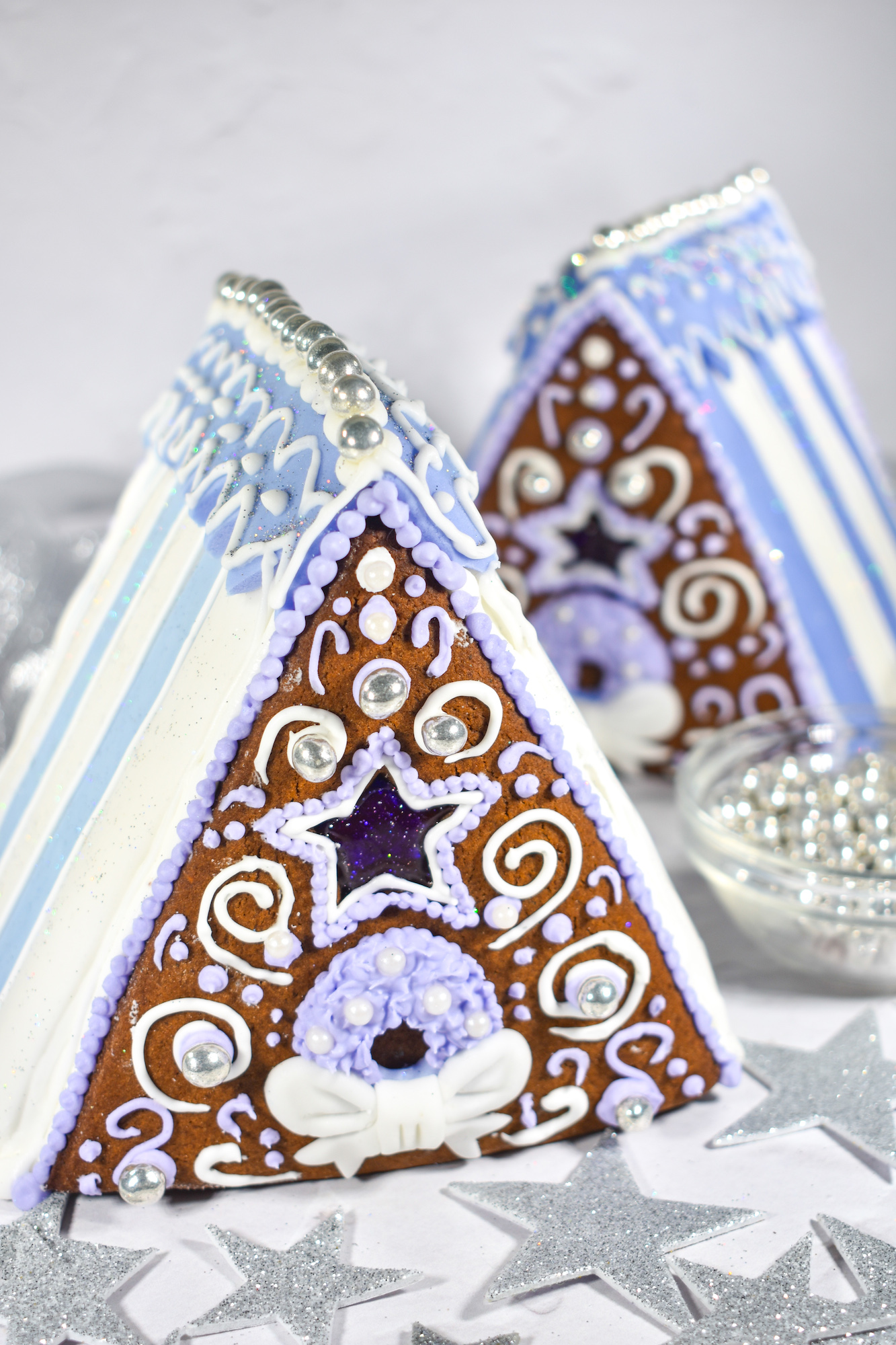 Gingerbread houses on a white surface