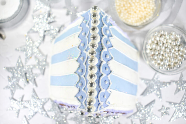 Top view of blue and white striped gingerbread house