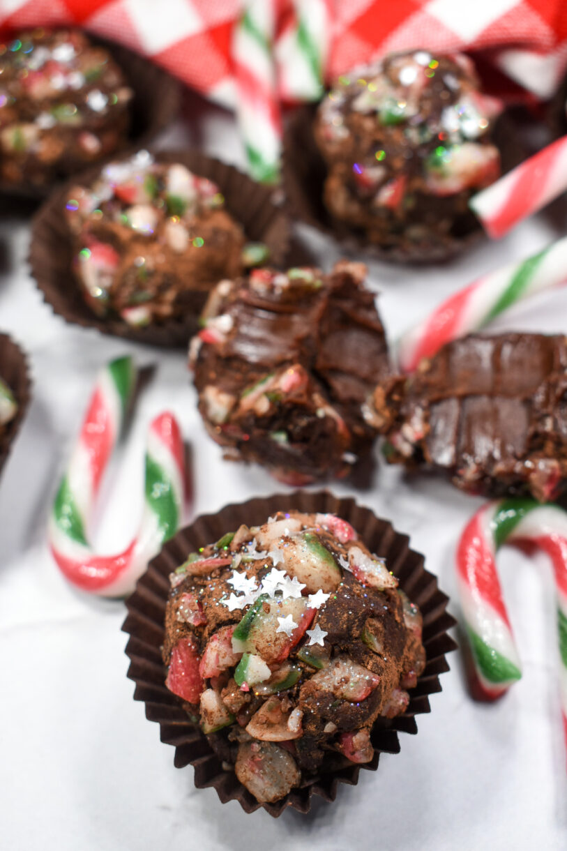 Candy cane Christmas truffle recipe and crushed candy canes on white surface