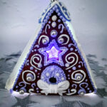 Gingerbread house with glowing purple light