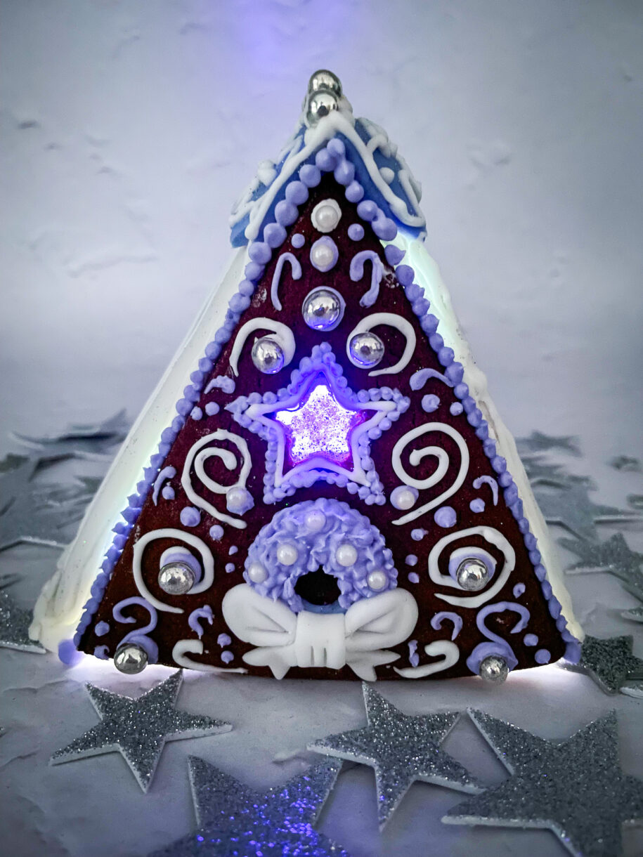 Gingerbread house with glowing purple light