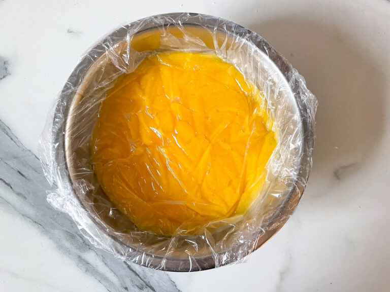 Lemon curd in a bowl with clingfilm