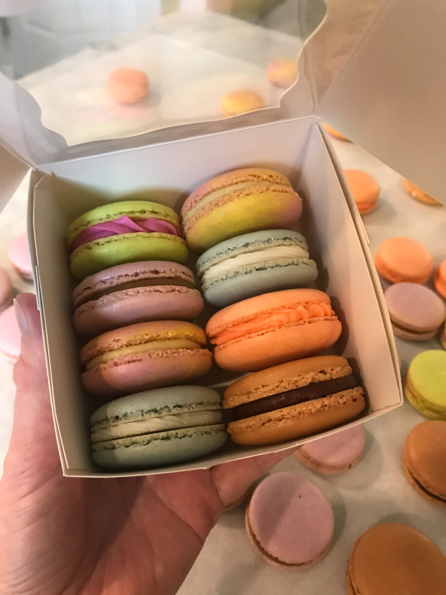 A box with rows of macarons