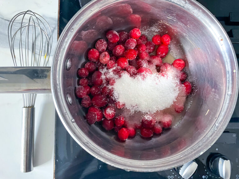 Cranberries and sugar in a saucepan
