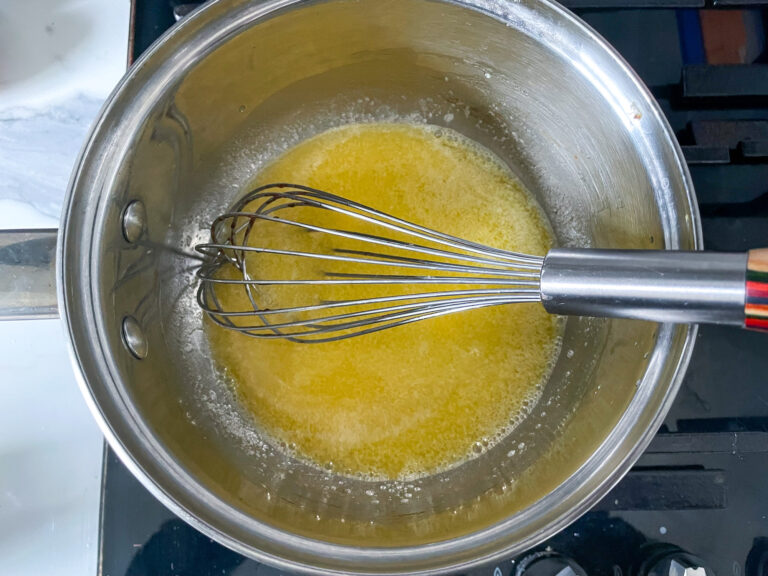 Melted butter in pan with whisk