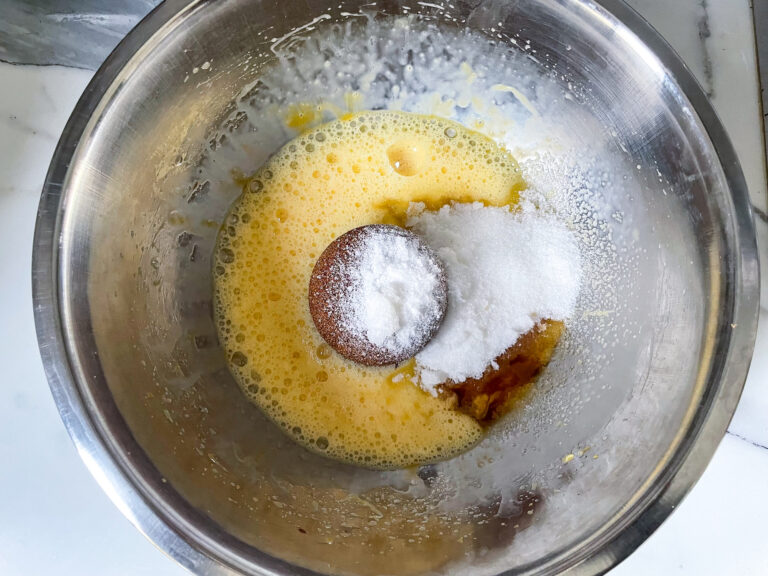 Sugars and eggs in a mixing bowl