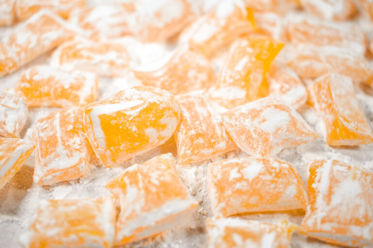 Lemon hard candy covered in powdered sugar