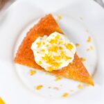 Flourless almond orange cake on a white plate