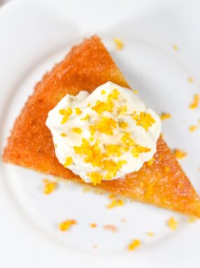 Flourless almond orange cake on a white plate