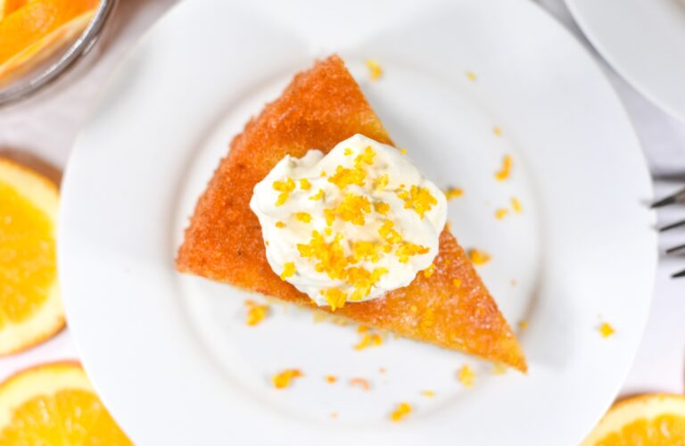 Flourless almond orange cake on a white plate