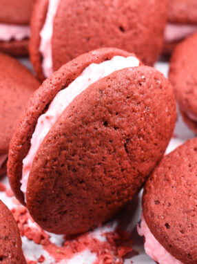 Red velvet whoopie pies with pink frosting