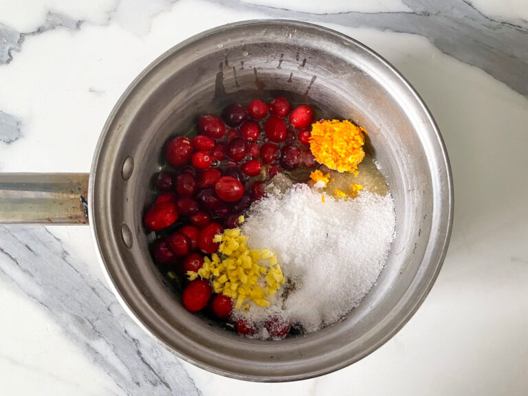 Cranberry compote ingredients in a saucepan