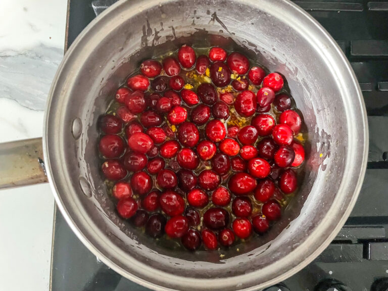 Red creanberries cooking on stovetop