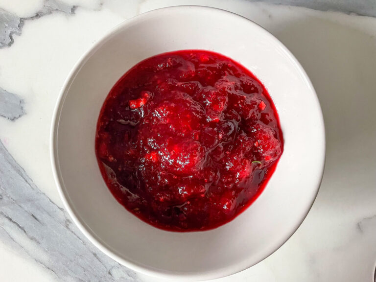 Homemade cranberry compote in a white bowl