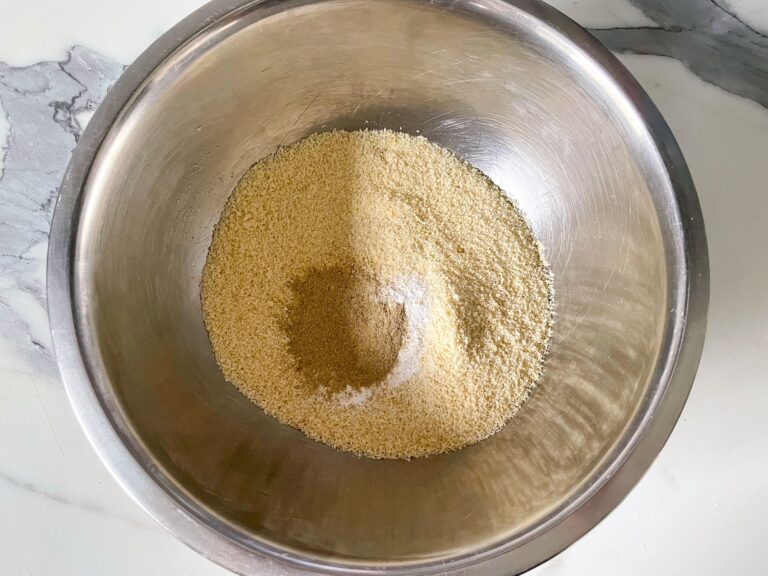Dry ingredients for flourless almond cake in a metal bowl