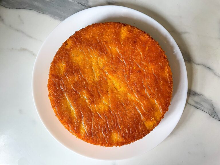 Flour less orange almond cake on a white plate