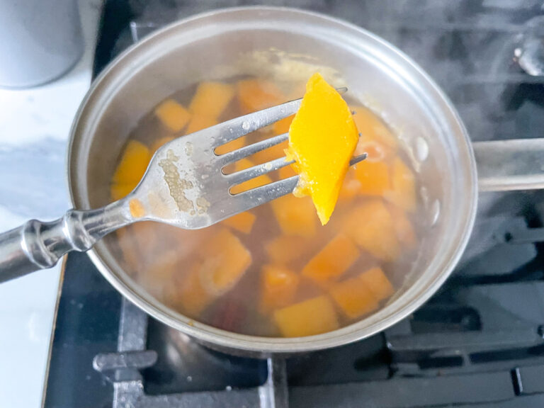 Butternut squash cubes and a fork