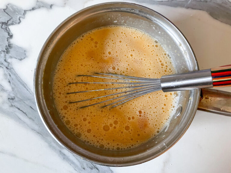 Whisk in a pan with butternut squash pudding ingredients