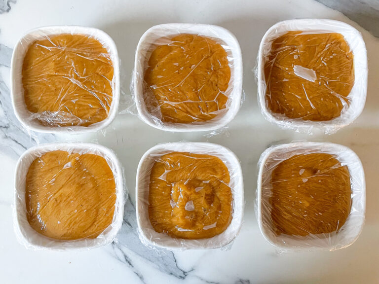 Small dishes of pudding covered with clingfilm