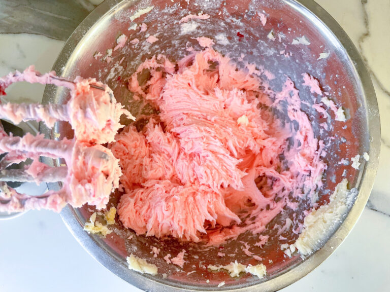 A bowl of pink frosting